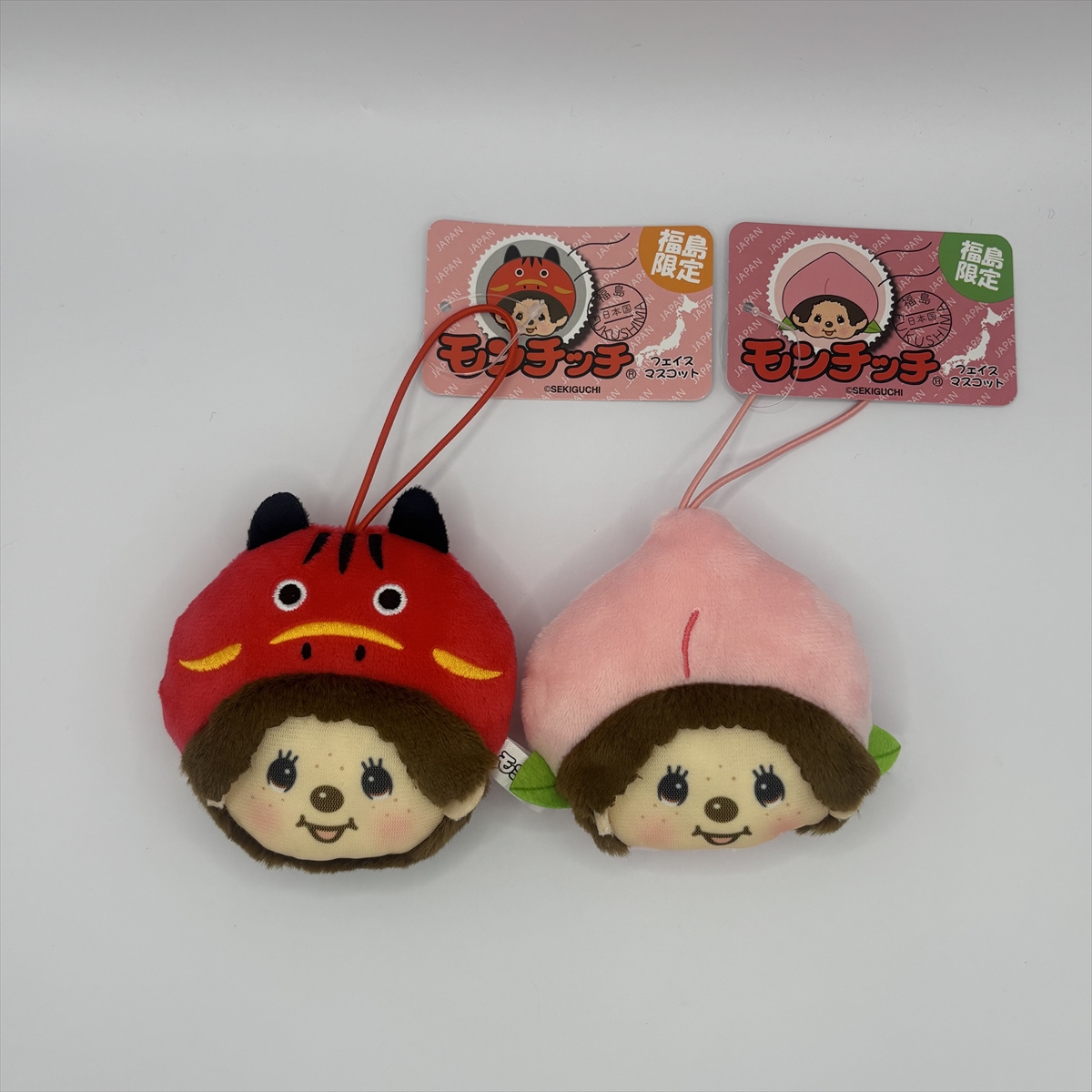 【福島限定！人気の赤べこに続くご当地シリーズ第2弾】モンチッチが「桃」に変身！フェイスマスコットが12月下旬に発売